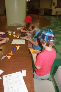 Making paper cranes in the lunch room.
